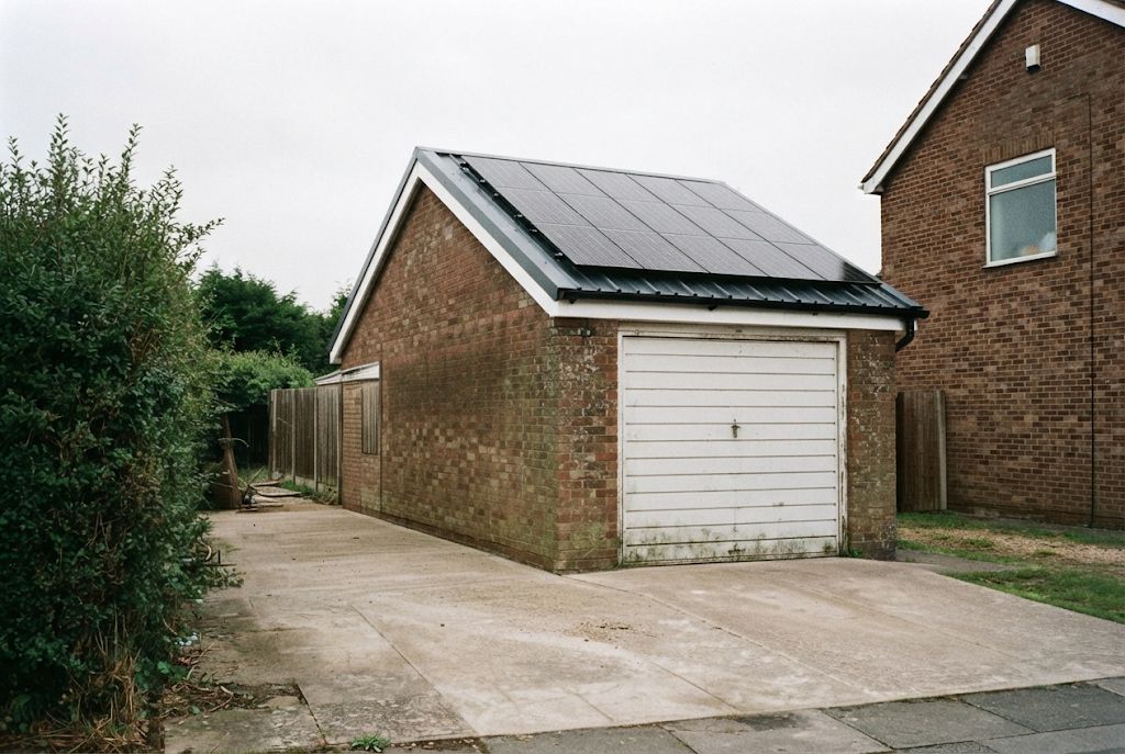 Garage with a new roof fitted with solar panels